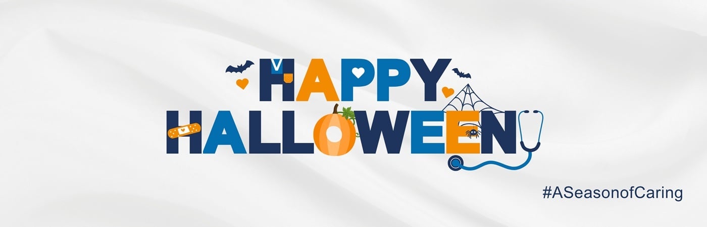 A banner image with the phrase 'Happy Halloween' including healthcare-themed icons and a hashtag reading #ASeasonofCaring